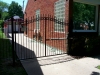 Custom Iron Driveway Gate with Gate Operator, Rings and Finials Design