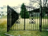 Double Wrought Iron Arched Pedestrian Garden Gate with Scrolls and Finials Design