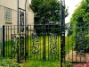 Custom Wrought Iron Arched Double Garden Gate with Finials and Ornamental Scrolls