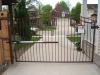 Brown Arched Driveway Gate with Gate Operator