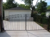Custom Wrought Iron Arched Driveway Gate with Rings and Finials