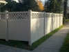 Tan Kingston Vinyl Privacy Fence with Customized Lattice Top Design